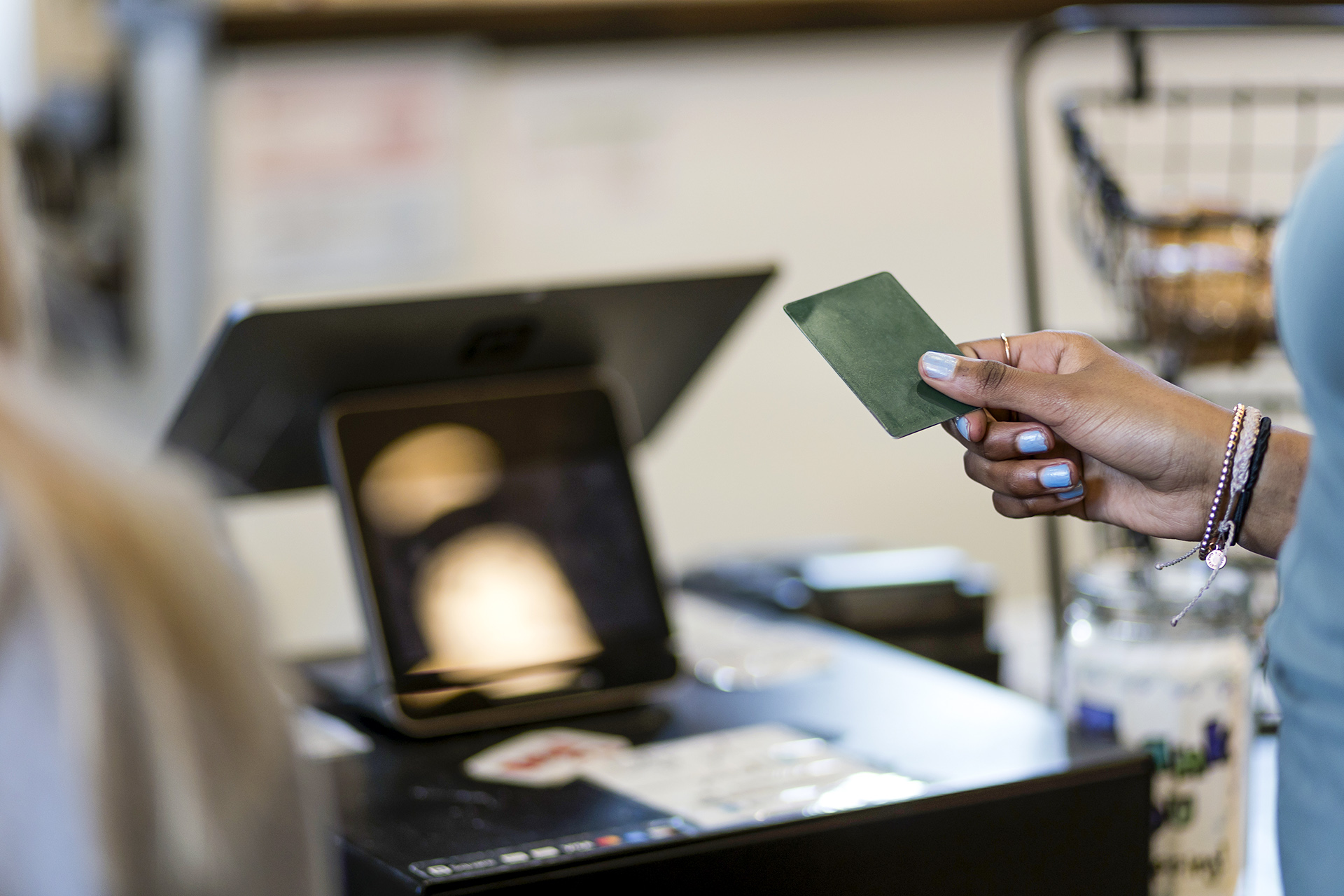 A person pays for a purchase with a credit card. (Nathan Bilow/Getty Images)